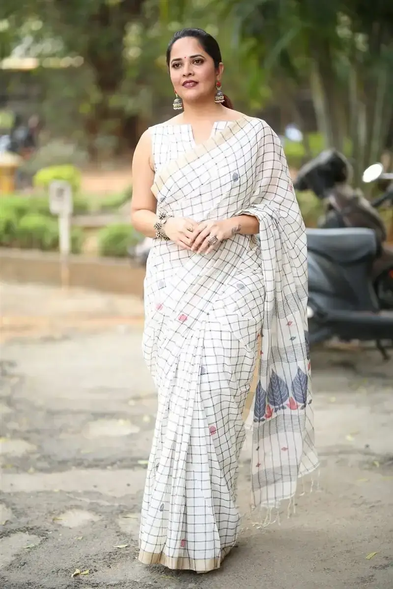 Anasuya Bharadwaj in White Saree at Razakar Movie Launch